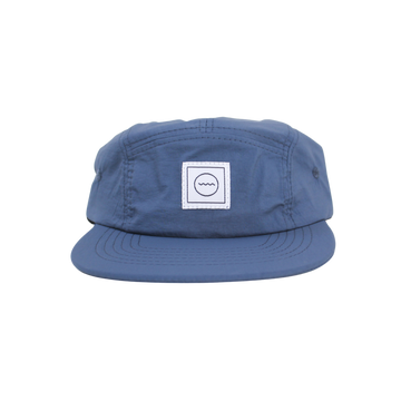 A navy blue nylon five-panel hat with an adjustable velcro back and fabric eyelets on the side panels.